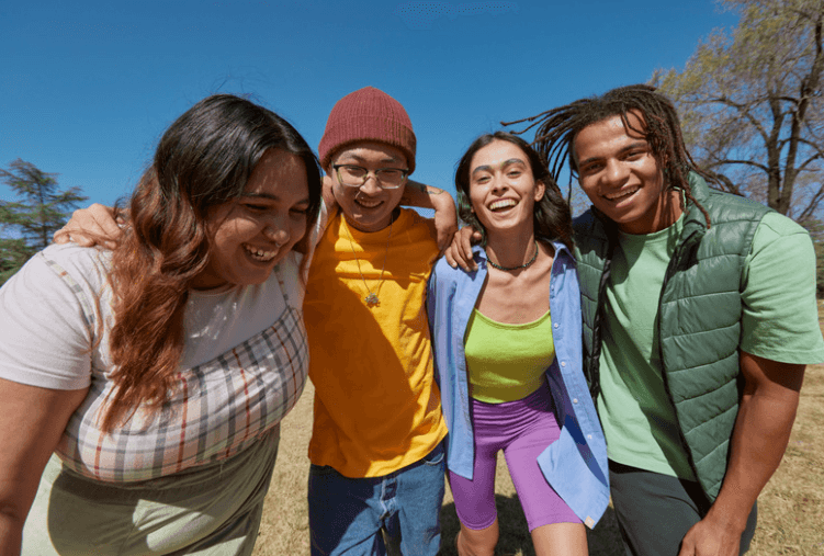 Four smiling adults